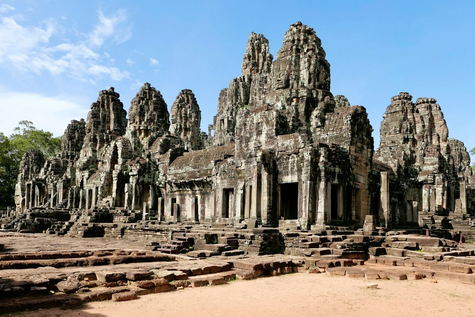 Ancient stone temple with many towers under blue sky