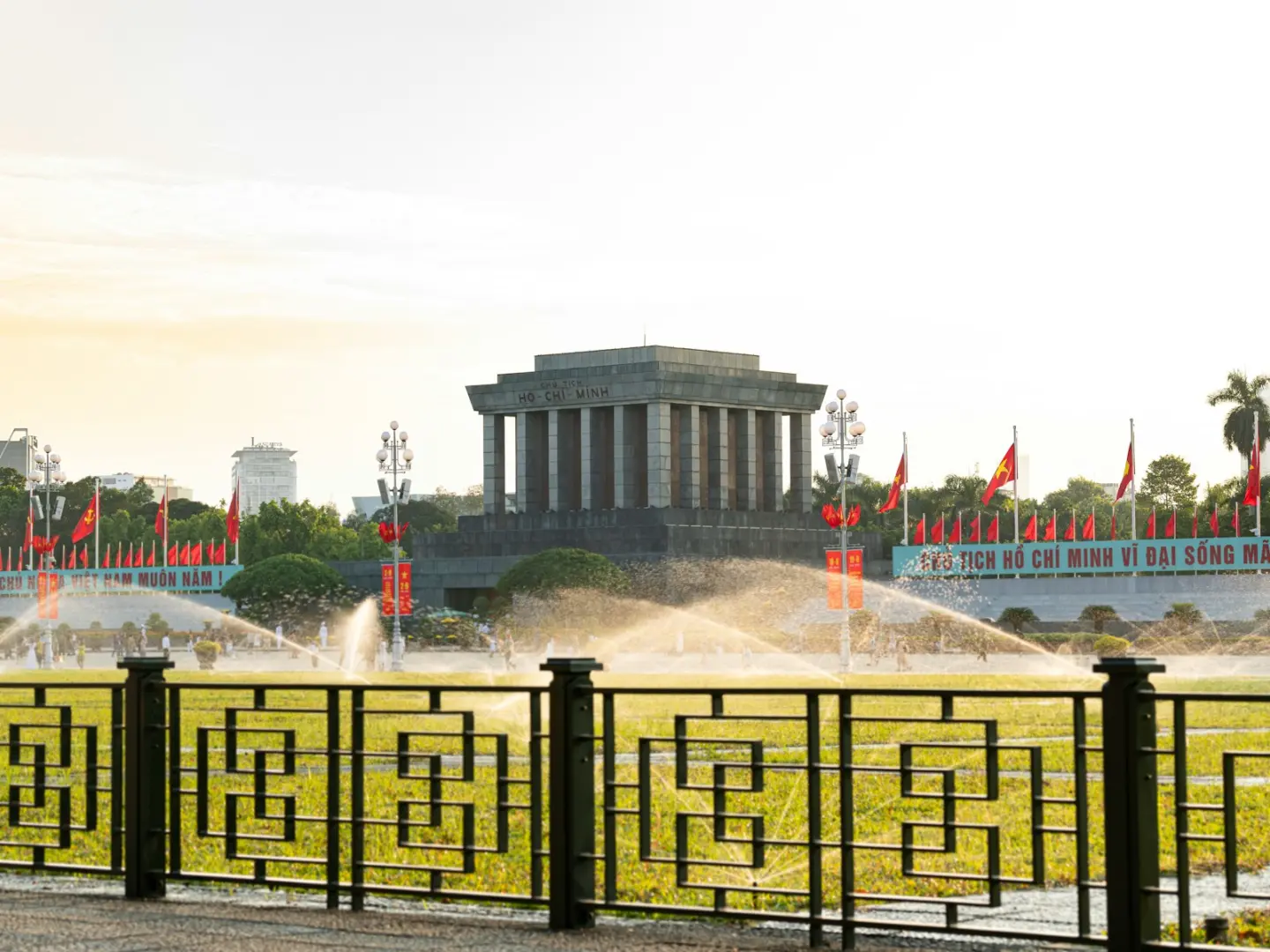 A view of a park with a fountain in the middle of it