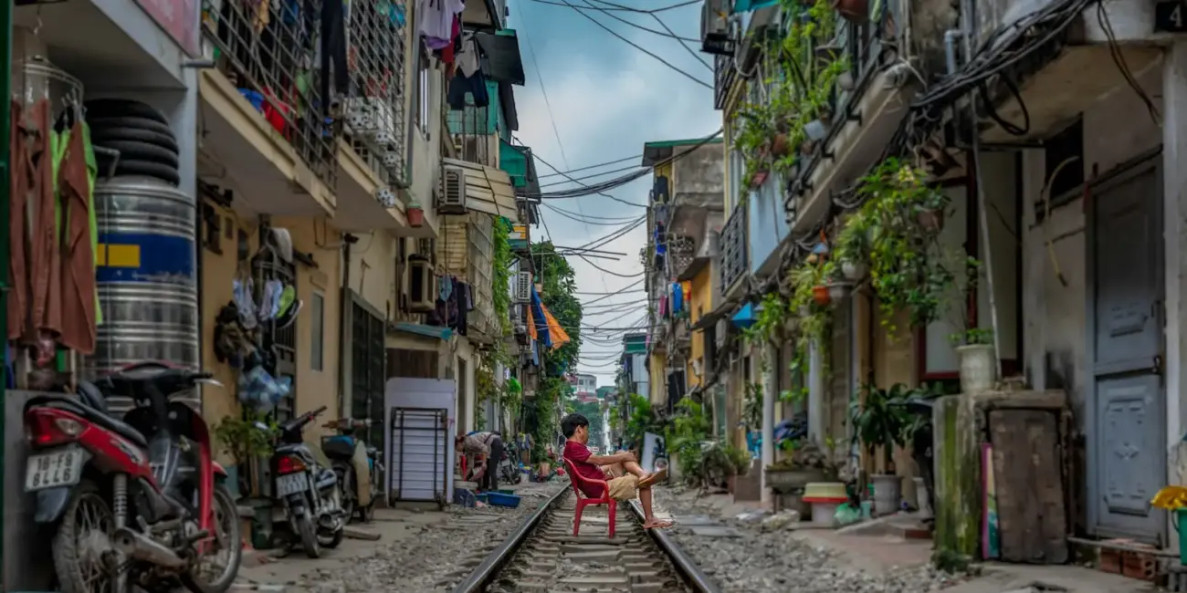 man sitting on railway
