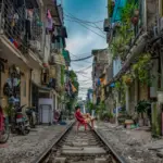 man sitting on railway