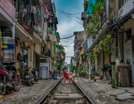 man sitting on railway