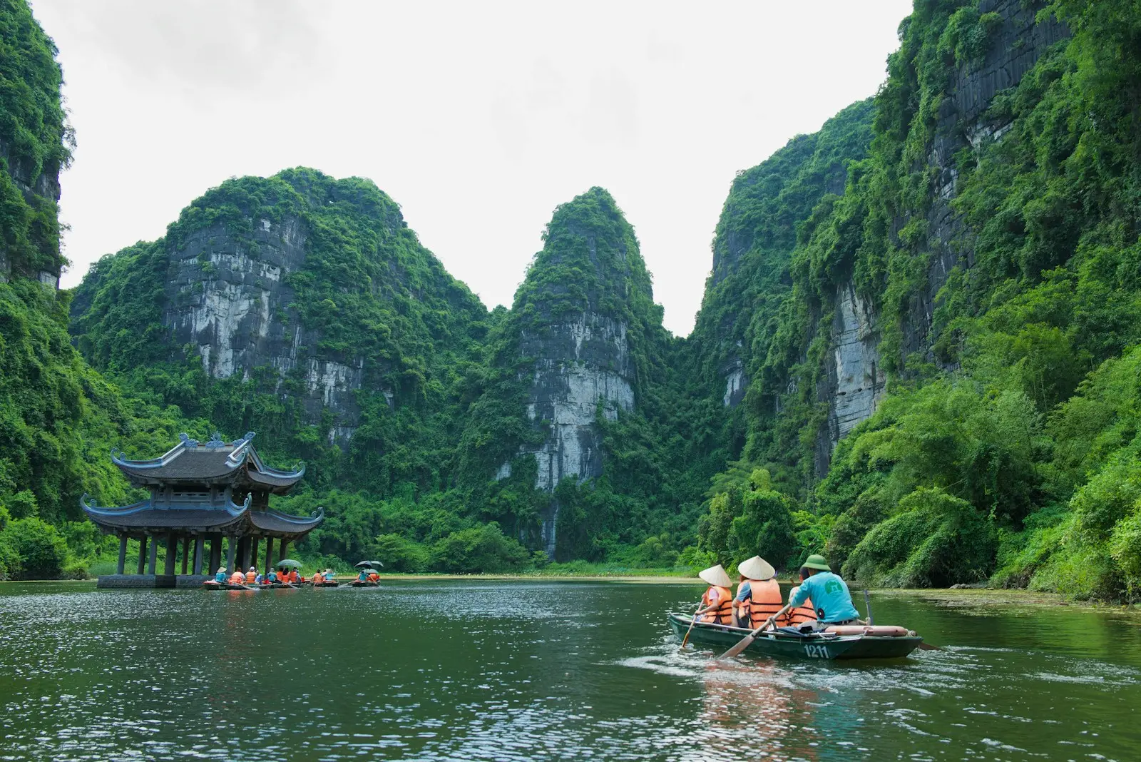 A group of people in a small boat on a river