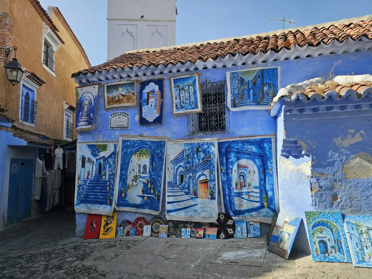 Blue building with artwork displayed outside