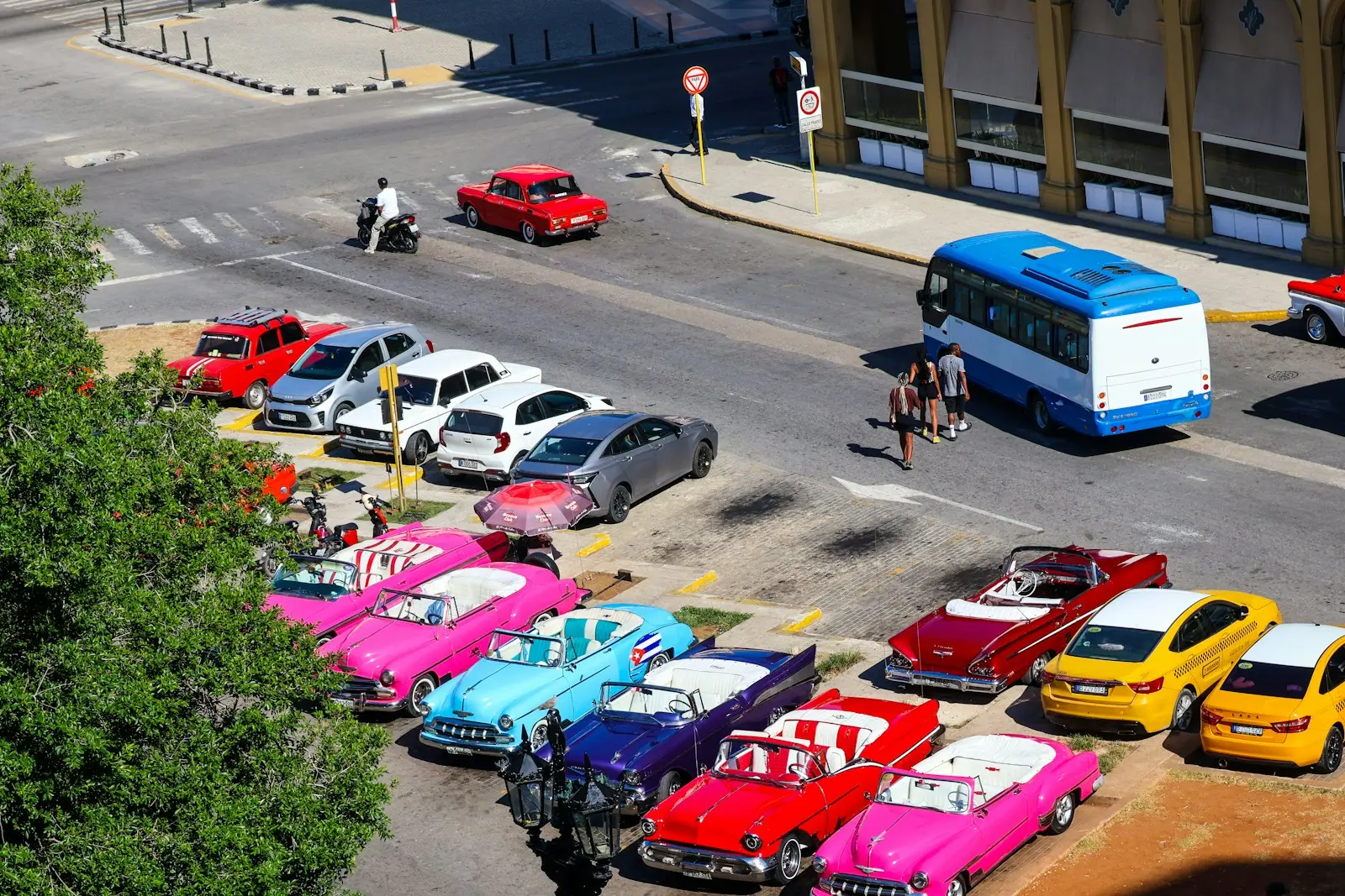 Classic cars parked on a city street.