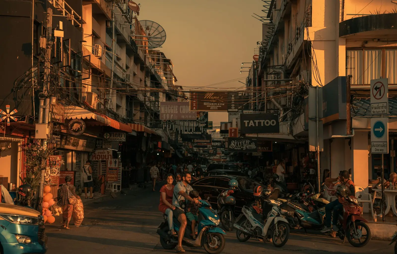 a group of people riding motorcycles down a street