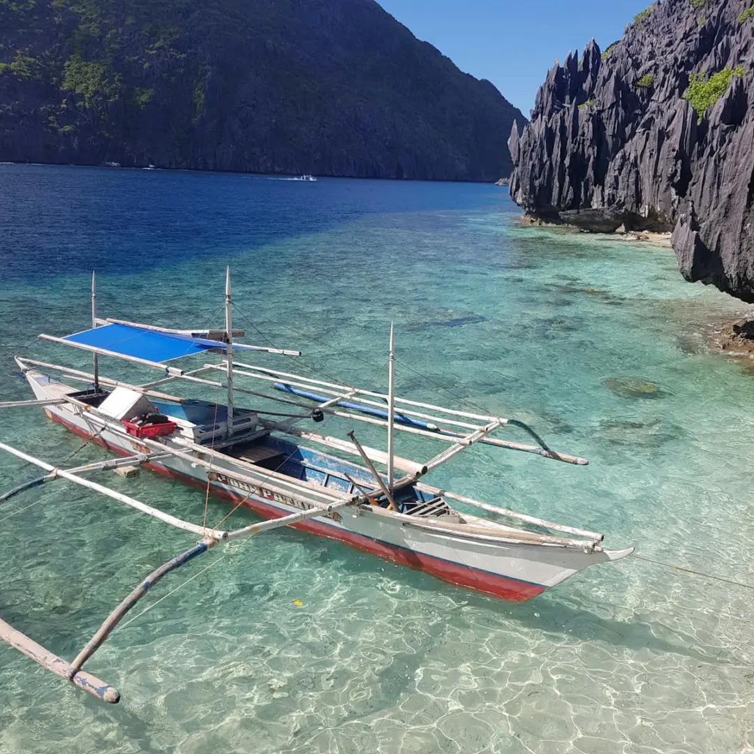 Photo by Matthew De Zen white and red boat on sea during daytime
