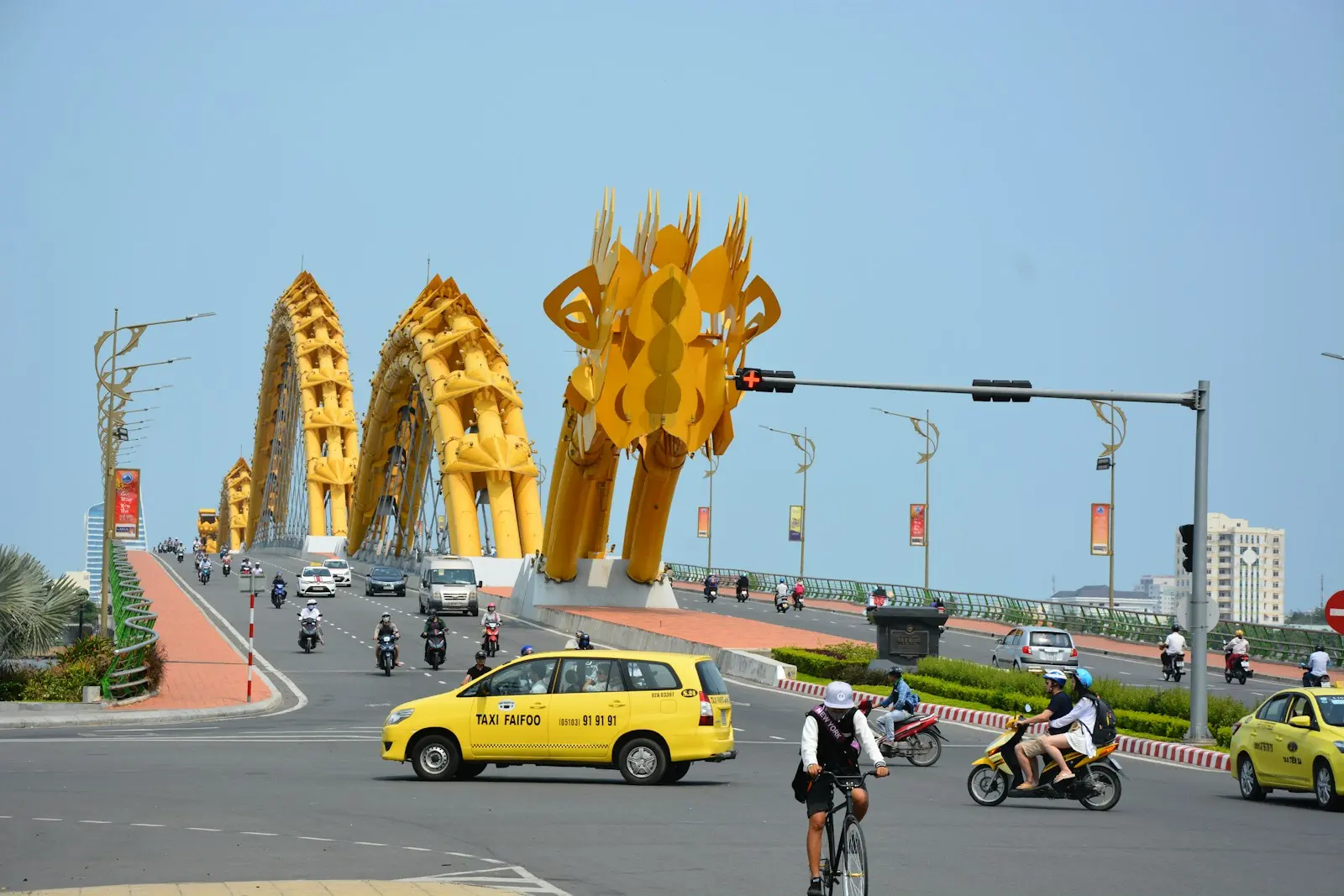 man in black shirt riding bicycle on road during daytime