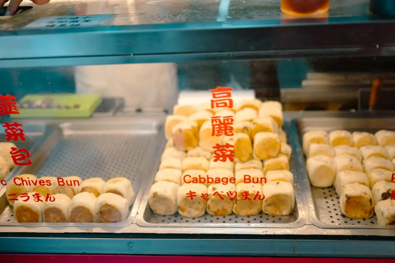 Various buns displayed in a food stall