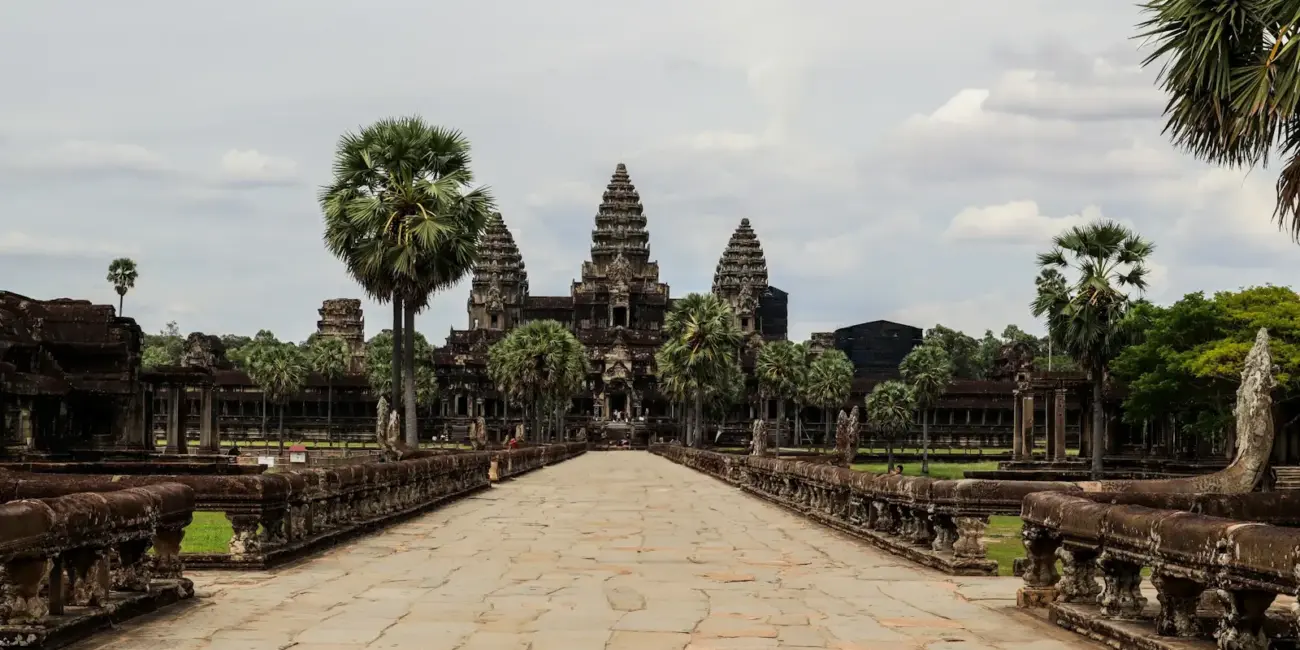 A stone walkway leading to a large building