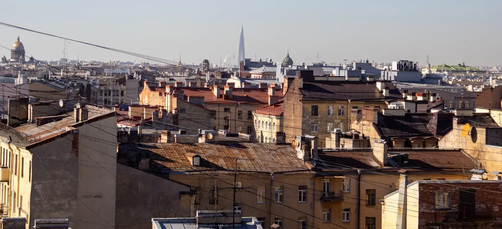 Photo by Ann Yozh Cityscape with buildings and a tall spire.