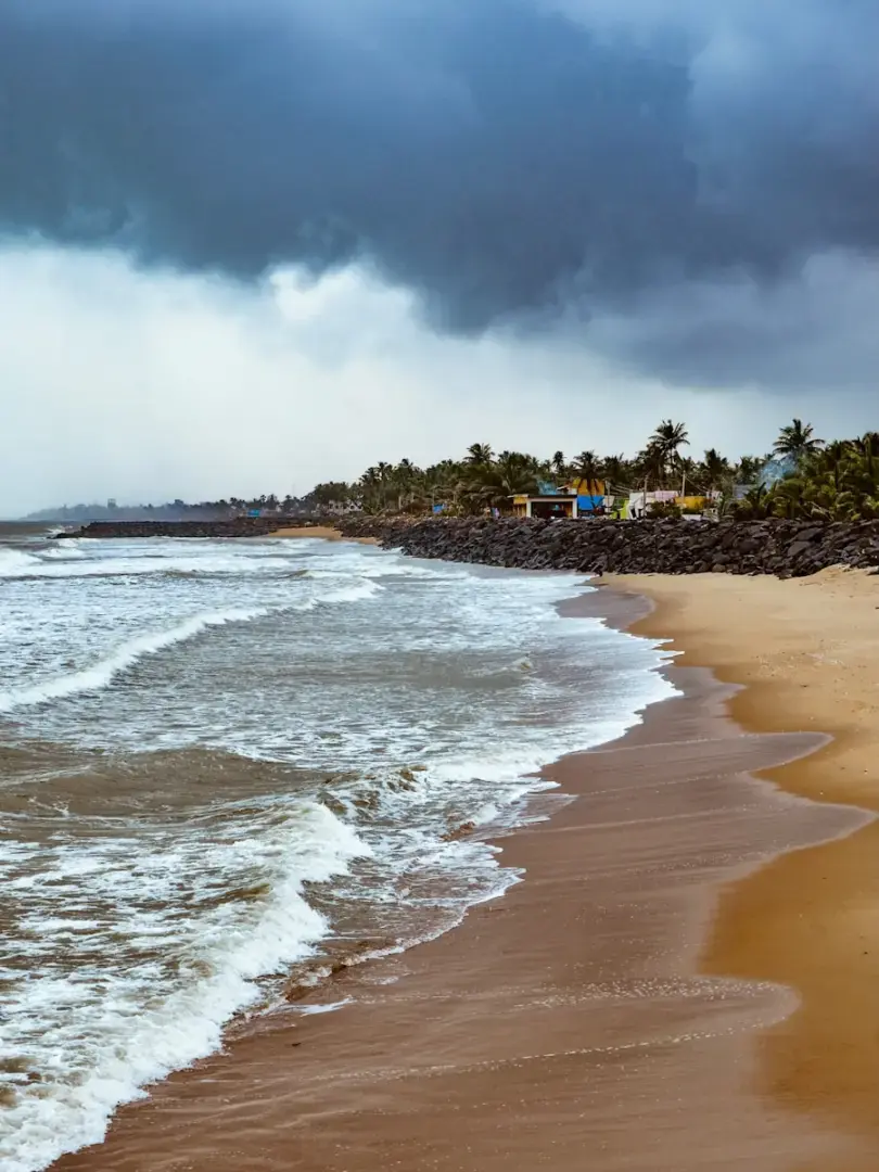 Photo by Abhinav beach shore under cloudy sky during daytime