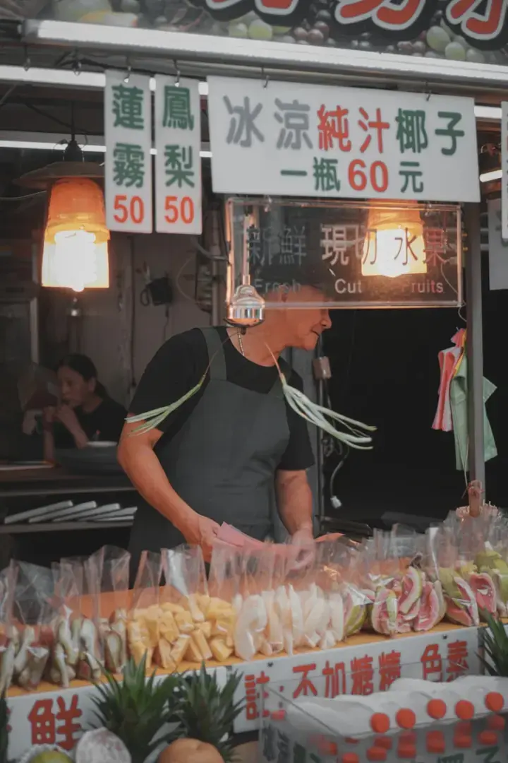 Photo by Lisanto 李奕良 man in black t-shirt and gray denim jeans holding clear plastic bag