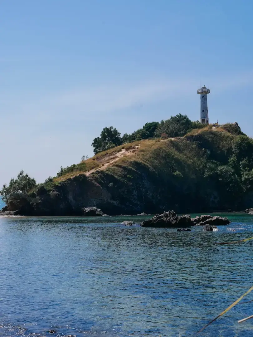 A small island in the middle of a body of water