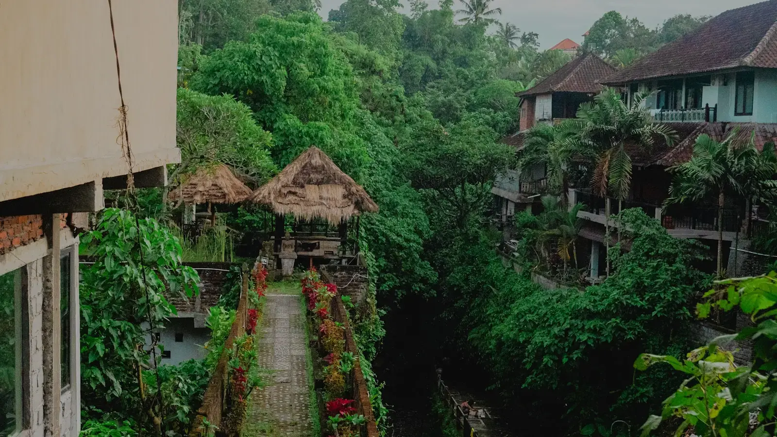 Overlooking huts, bridges, and lush greenery.