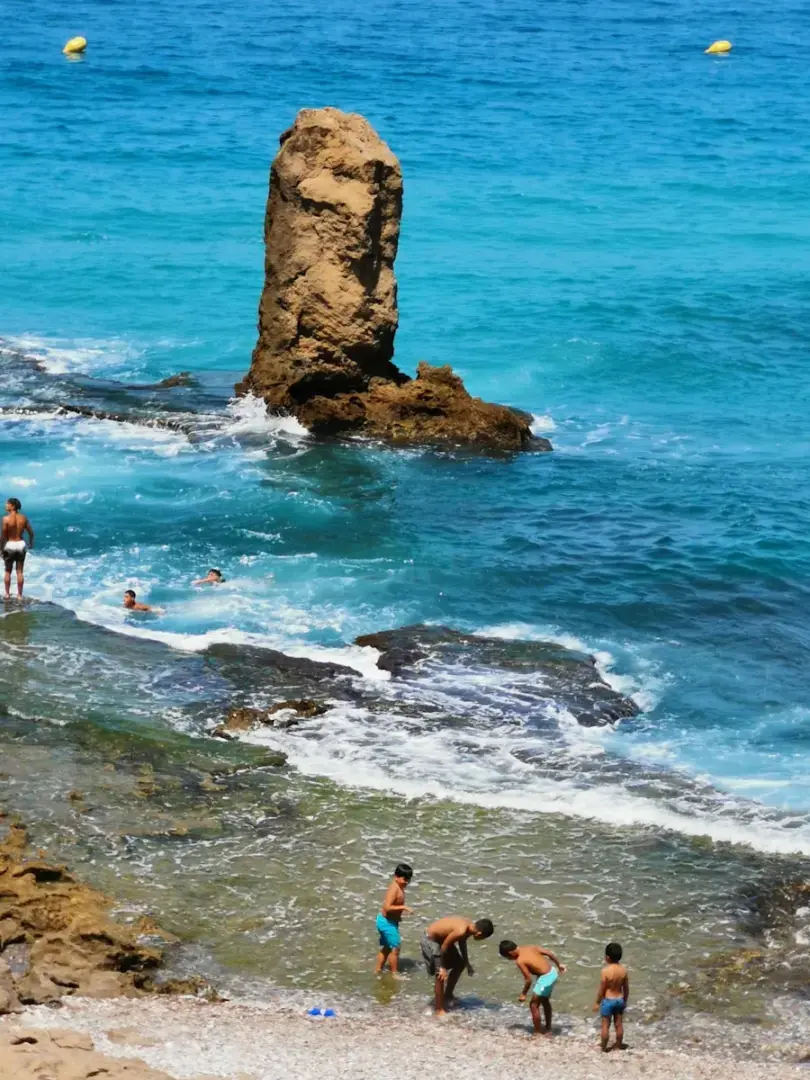 Photo by Tayebioui Omar people on beach during daytime