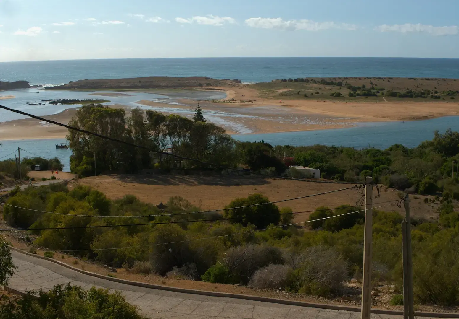 Photo by Anas ETTAOUDI A view of the ocean from the top of a hill