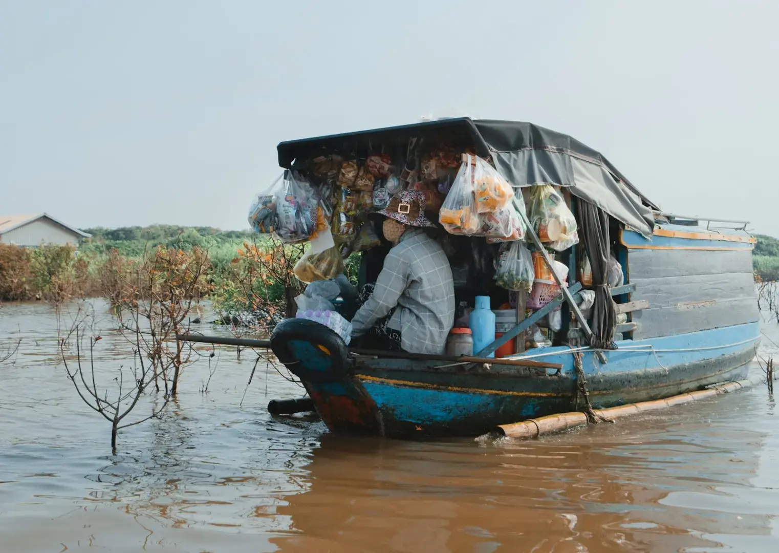 Photo by Evgeny Matveev A small boat selling goods on the water