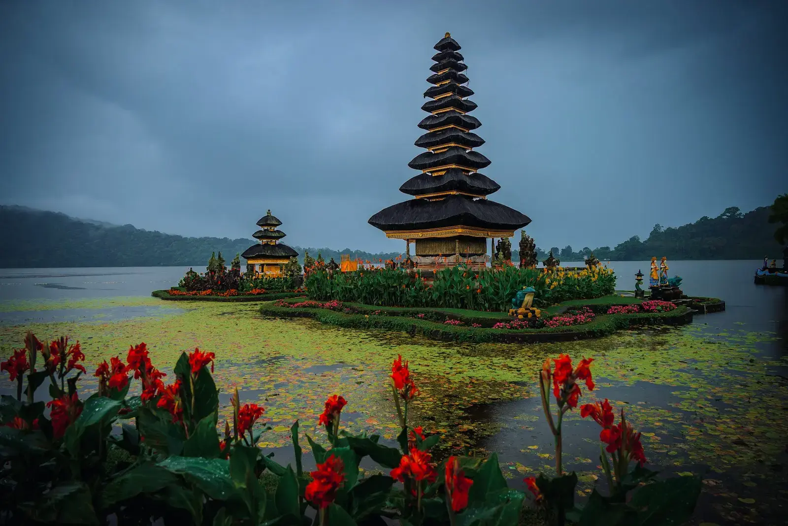 Temple on island in lake with flowers