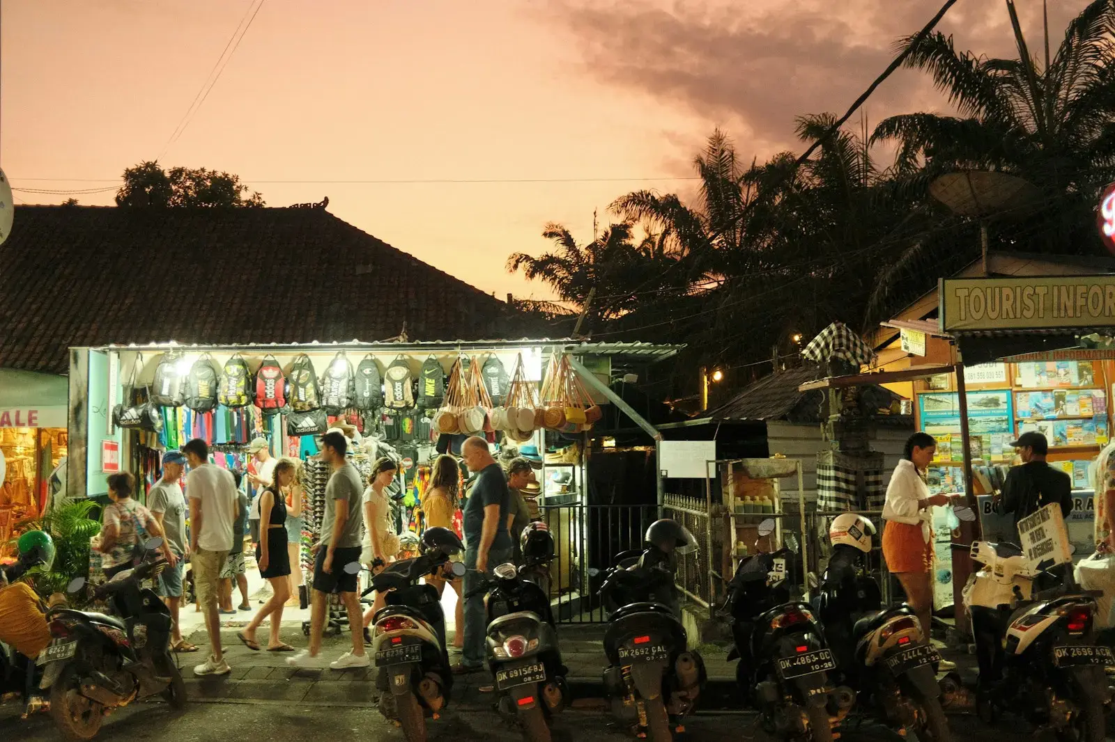 a group of people stand outside a shop