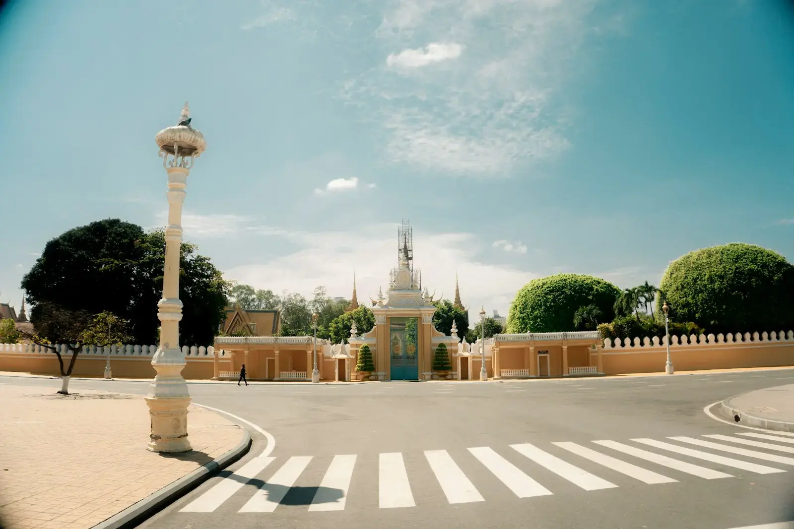 Photo by an thet Grand entrance to a building with ornate lamppost
