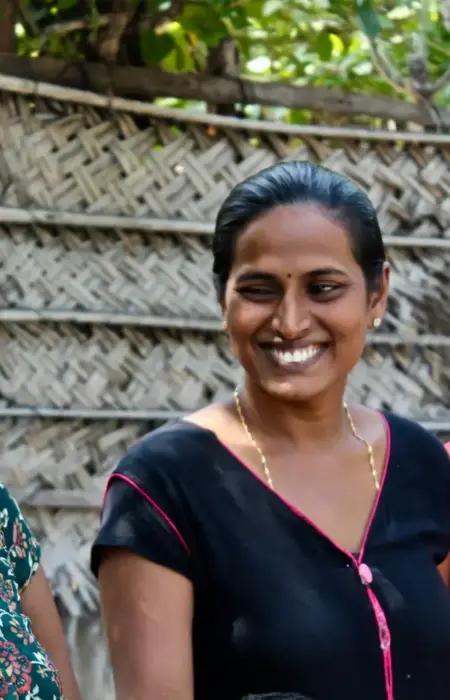 three women wearing assorted-color shirts