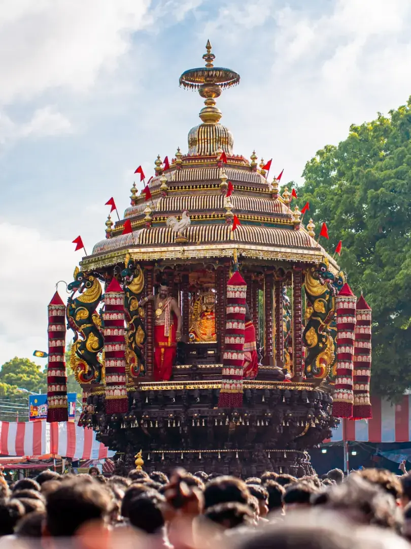 A large crowd of people watching a float in a parade