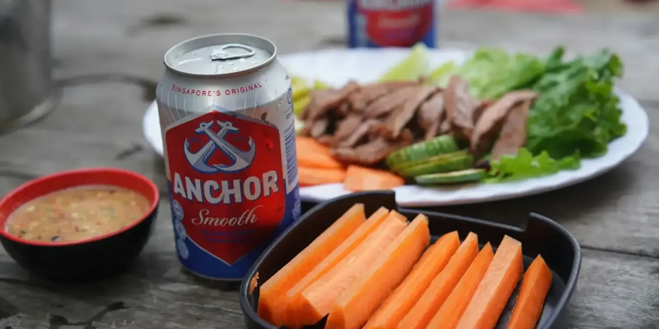 a plate of food and a can of soda