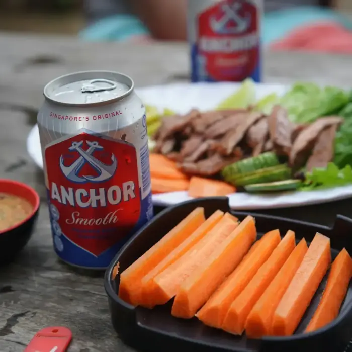 a plate of food and a can of soda