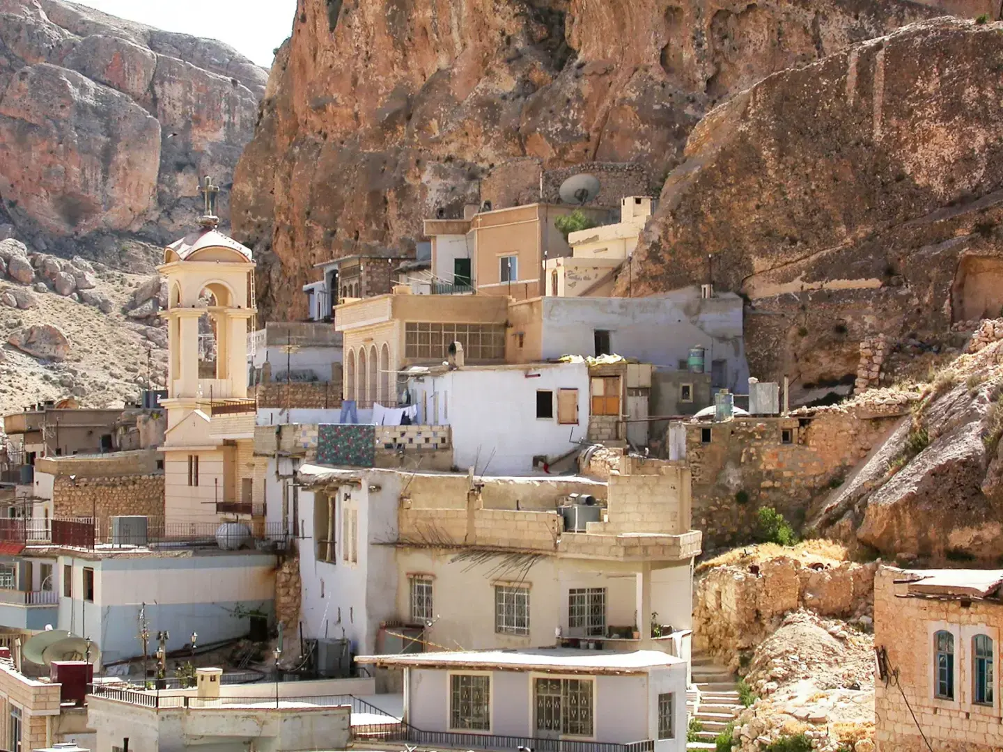 Ancient village nestled in a rocky mountain landscape.