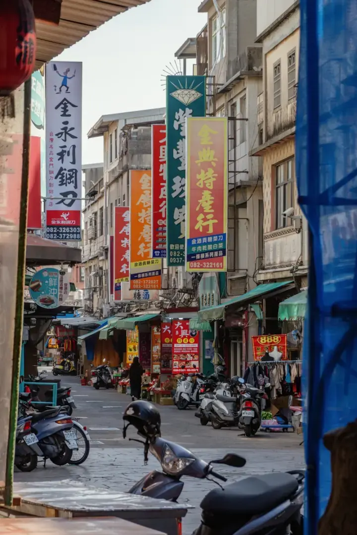 Street scene with shops and parked motorcycles