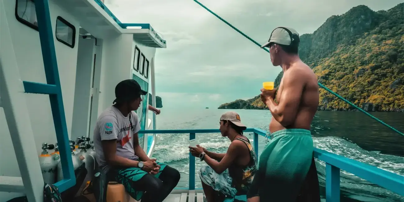 People enjoy a boat ride on a tropical day.