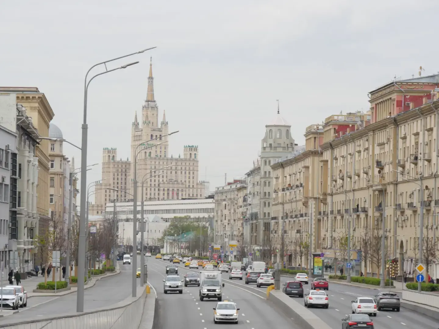 Photo by Elliot Williams View of Moscow cityscape with Kudrinskaya Square Building, highlighting urban architecture and traffic.