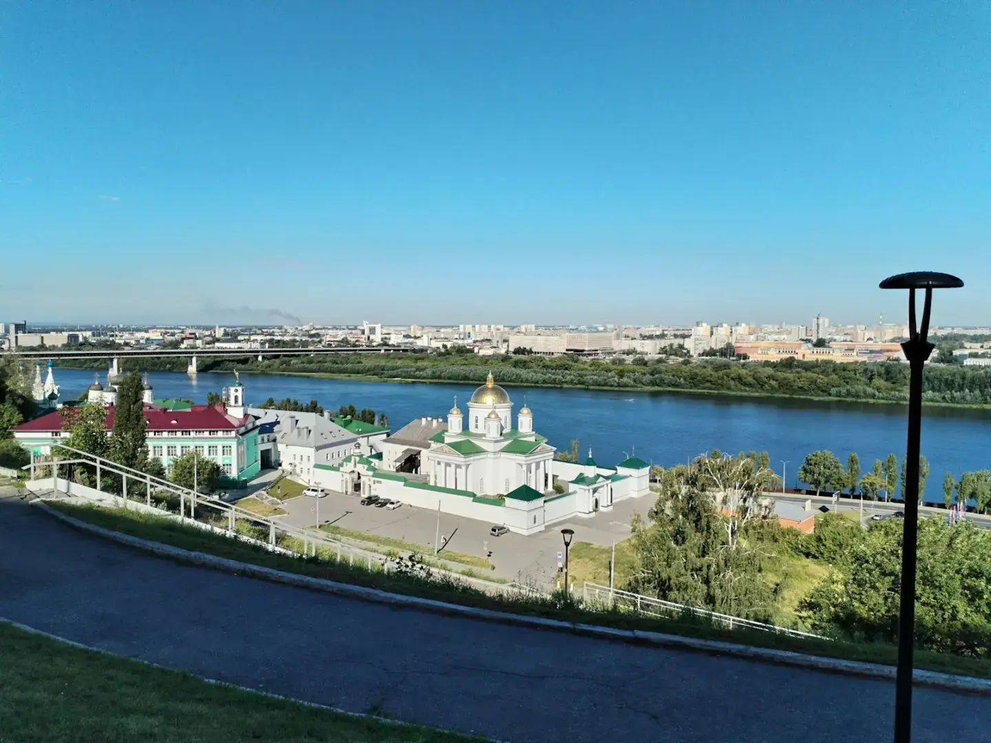 Photo by Павел Малюгин A view of a river and a city from a hill