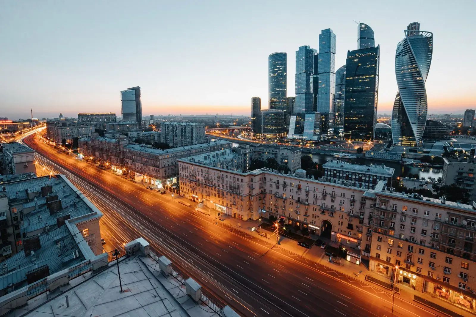 Photo by Max Avans Aerial view of Moscow's skyscrapers and urban skyline during twilight, showcasing modern architecture.