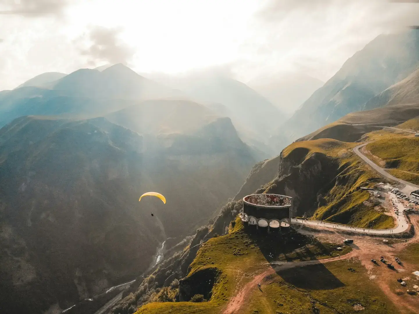 Photo by Jairph person paragliding on mountain cliff during daytime