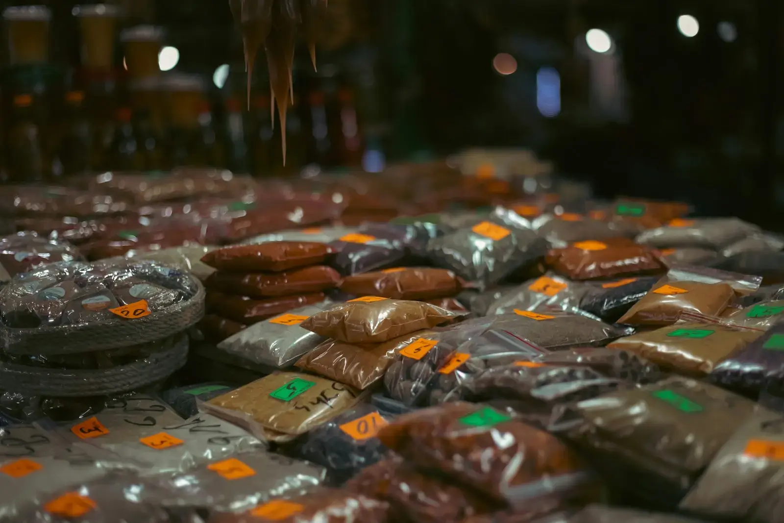 Photo by Nick Osipov a pile of hot dogs wrapped in plastic bags