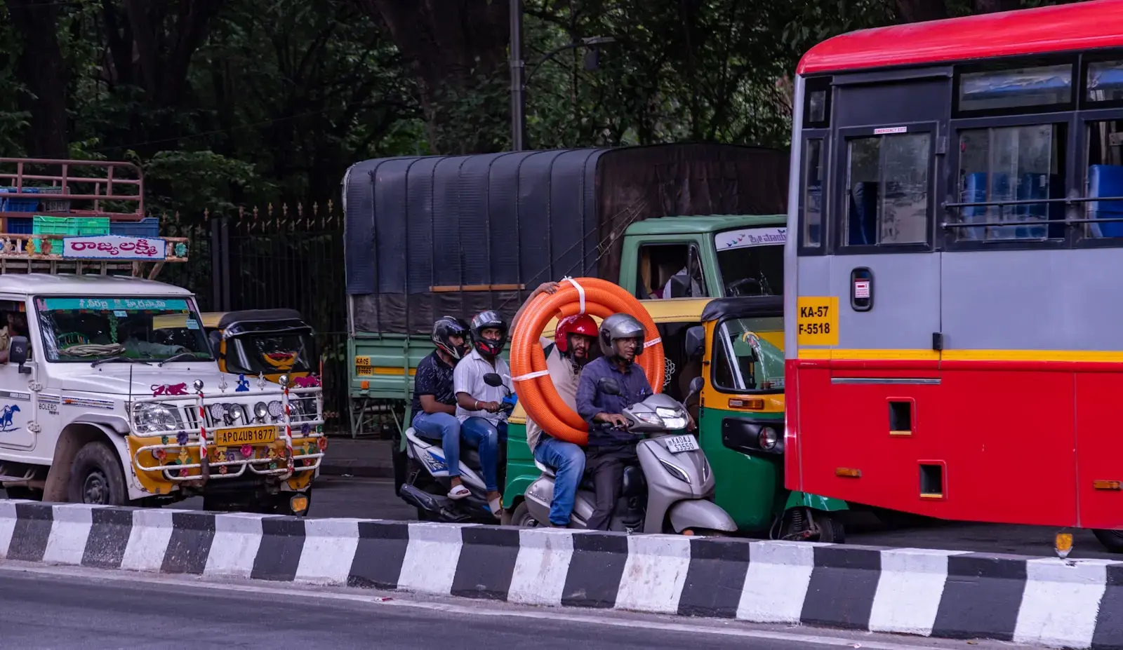 a group of people riding on the back of a motorcycle