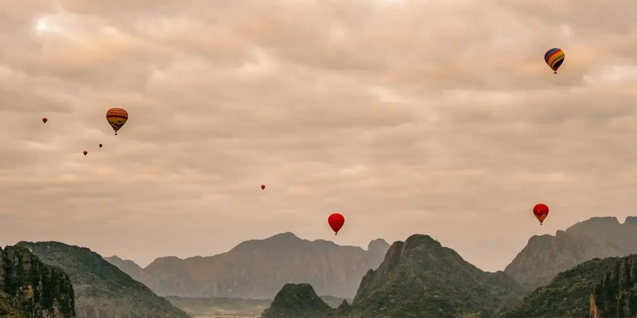 A group of hot air balloons flying in the sky