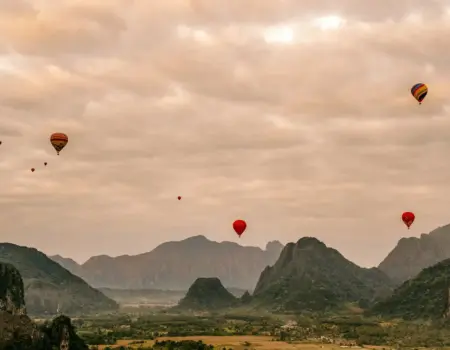 A group of hot air balloons flying in the sky