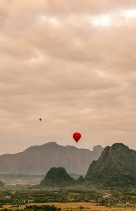 A group of hot air balloons flying in the sky