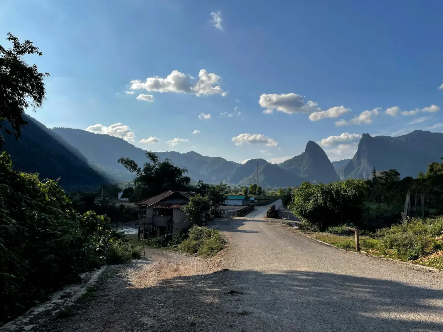 Photo by Marijn Flapper a dirt road with mountains in the background