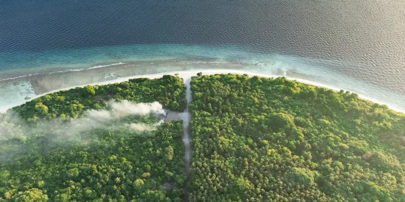 An aerial view of a tropical island in the ocean