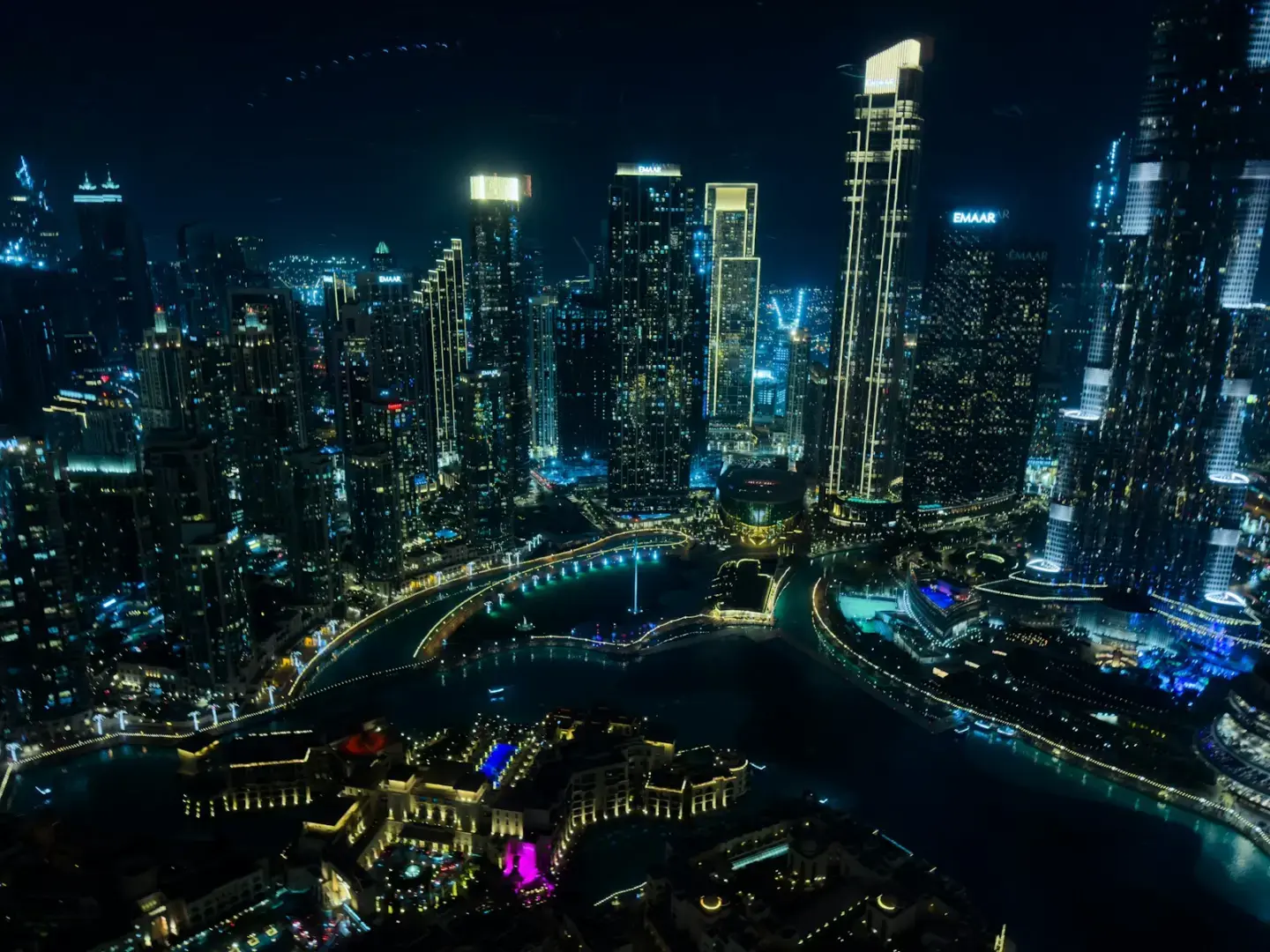 Modern cityscape with illuminated skyscrapers at night