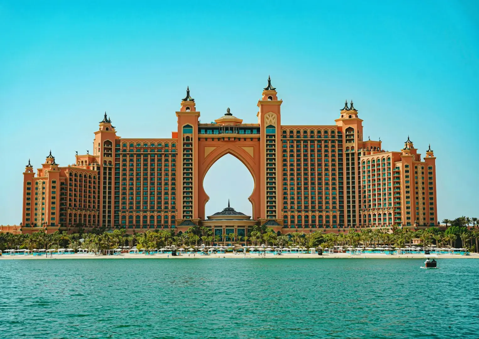 Photo by Xiaoqian Shen Grand hotel with archway on a sunny day