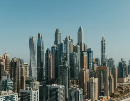 An aerial view of a city with tall buildings