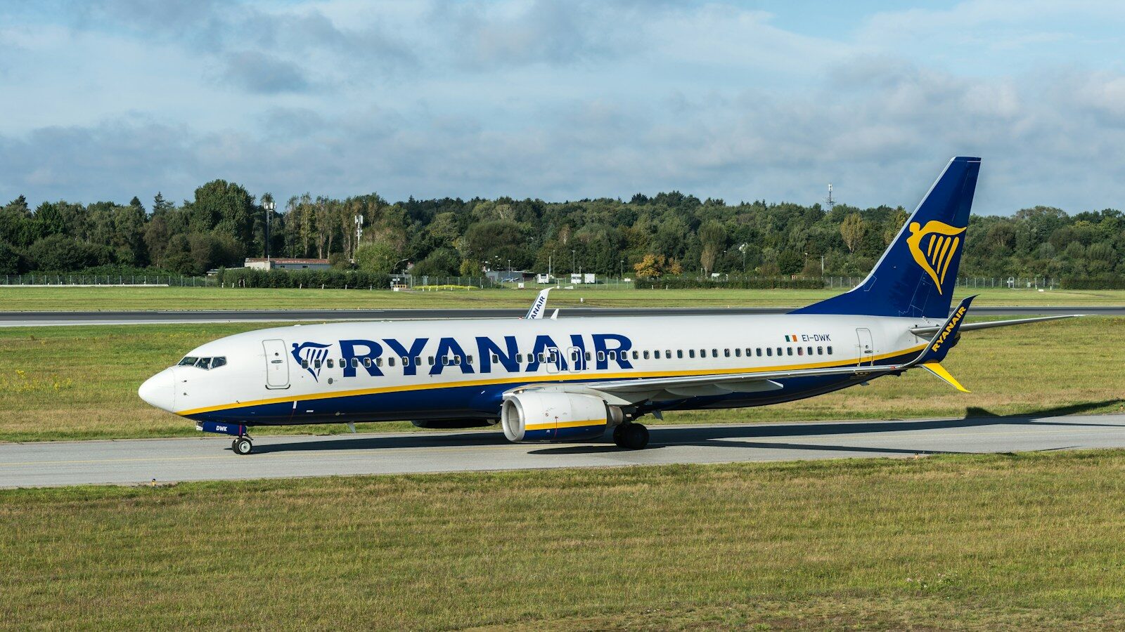Photo by Wolfgang Weiser A Ryanair passenger jet taxiing on an airport runway near a grassy field